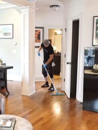 Cleaner Mopping the Floor