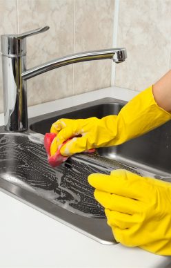 Cleaning the Sink with Soap and Cloth