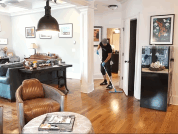 Cleaner Mopping the Floor