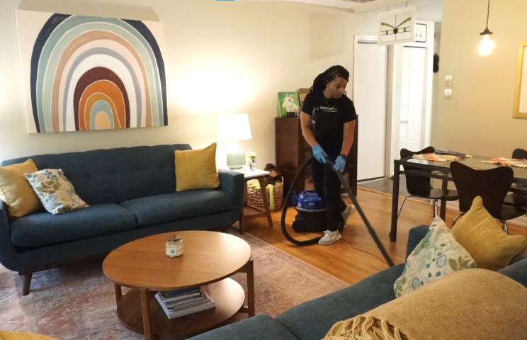 Cleaner Cleaning the Floor with Vaccum Cleaner